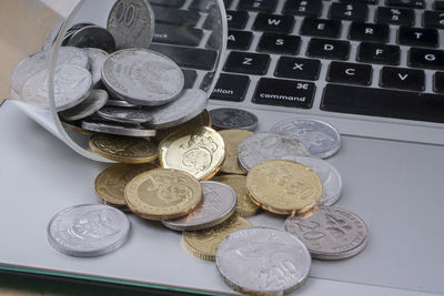 High angle view of coins on table