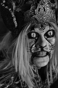 Close-up portrait of woman wearing mask