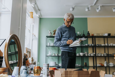 Side view of man working at home