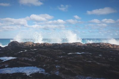 Sea waves splashing on rocks