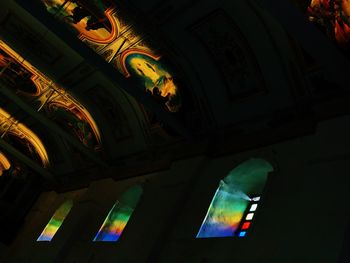 Low angle view of illuminated building at night