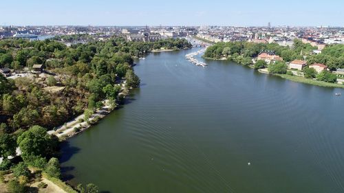 High angle view of river amidst buildings in city