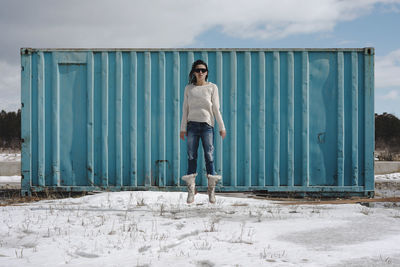 Portrait of man standing against wall