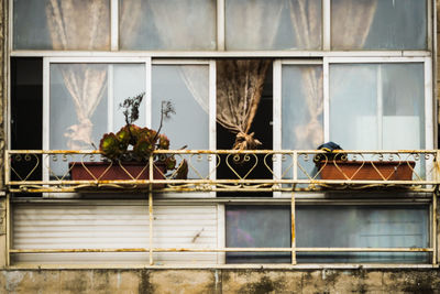 Broken glass window of building