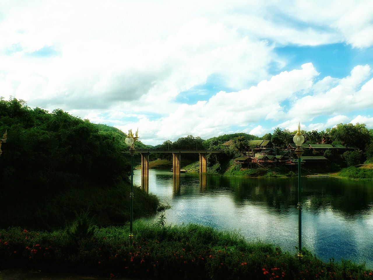 water, sky, tree, cloud - sky, built structure, lake, tranquility, tranquil scene, architecture, nature, plant, cloudy, cloud, scenics, river, reflection, beauty in nature, growth, day, outdoors