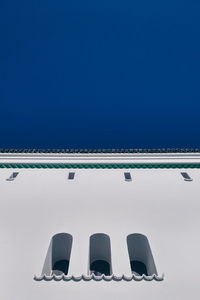 Row of airplane against clear blue sky