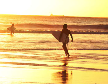 Scenic view of sea at sunset