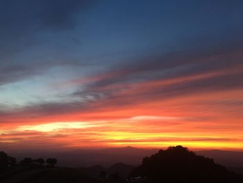 Scenic view of dramatic sky during sunset