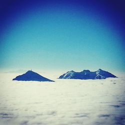 Scenic view of landscape against blue sky