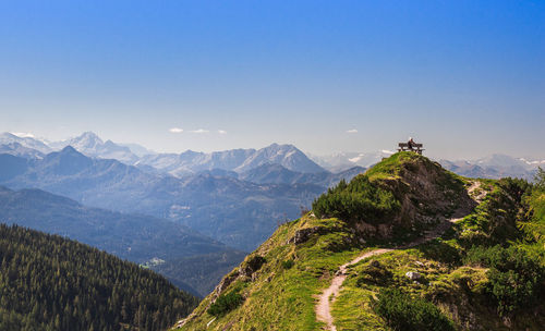 Scenic view of mountains against clear blue sky