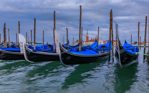 Boats moored at harbor