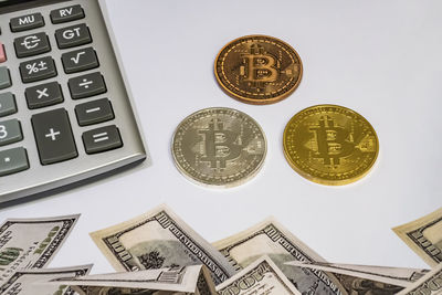 High angle view of coins on white background