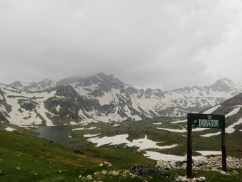 Scenic view of snowcapped mountains against sky