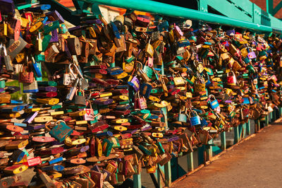 Close-up of padlocks hanging on bridge