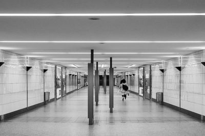 Rear view of woman in subway