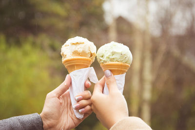 Cropped image of hand holding ice cream cone