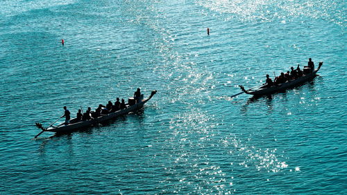 High angle view of people on boat in sea