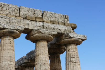 Low angle view of old ruins against clear sky