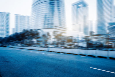 Blurred motion of modern buildings in city