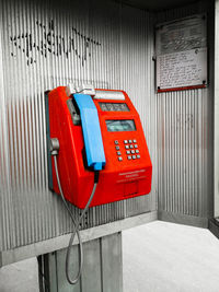 Close-up of telephone booth on wall