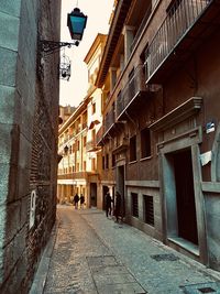 Street amidst buildings against sky