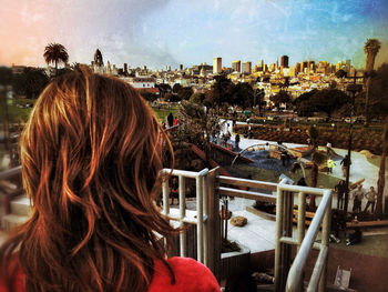 Woman looking at cityscape