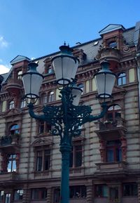 Low angle view of building against blue sky