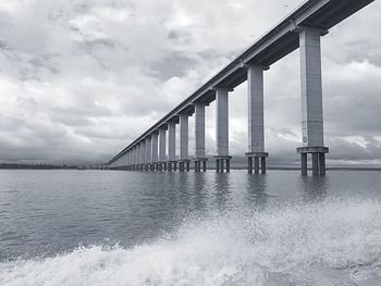 Bridge over sea against sky