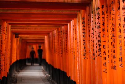 People in temple outside building