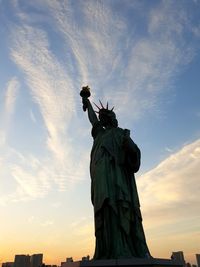 Low angle view of statue against sky during sunset