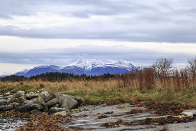 Scenic view of mountains against sky during winter