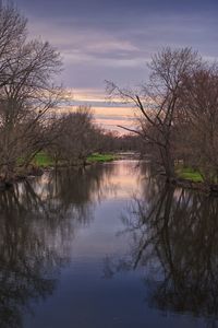 Scenic view of lake against sky during sunset