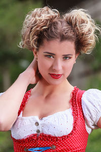 Close-up portrait of young woman wearing dirndl