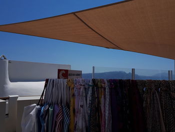 Low angle view of clothes drying against building