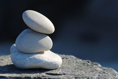 Stack of pebbles on sand at beach