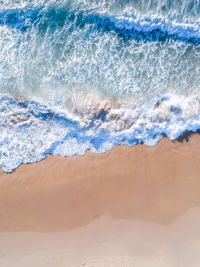 Close-up of wave on beach