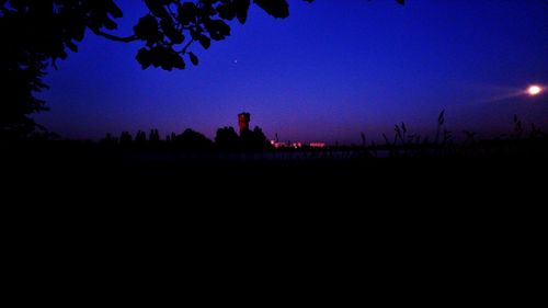 Scenic view of silhouette landscape against clear sky at night