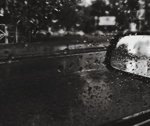 Water drops on car windshield during rainy season