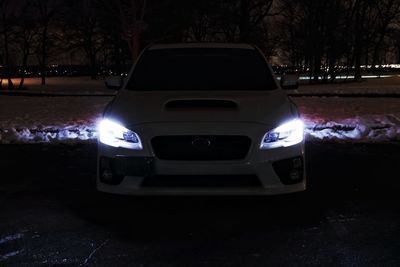 Car on road at night