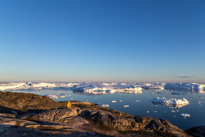 Aerial view of city against clear blue sky