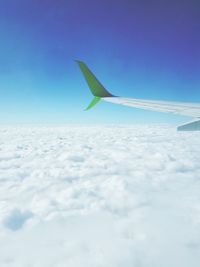 Airplane wing against sky