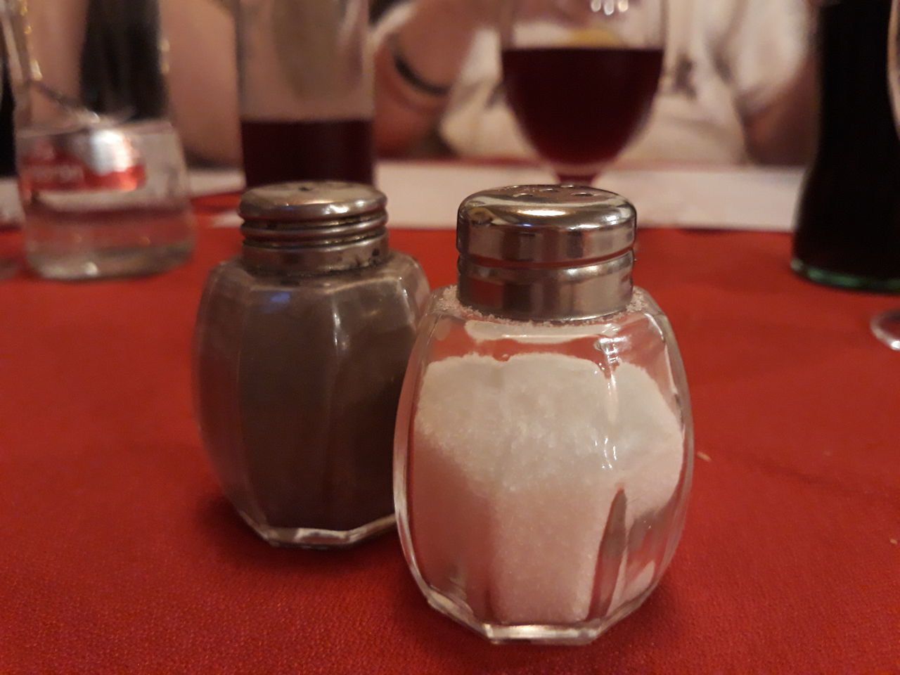 CLOSE-UP OF DRINK IN GLASS ON TABLE