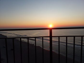 Scenic view of sea against clear sky during sunset