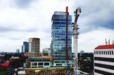 Modern buildings against sky in city