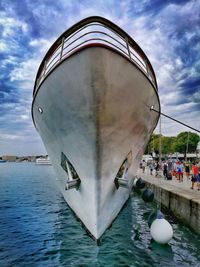 Close-up of boat in water against sky