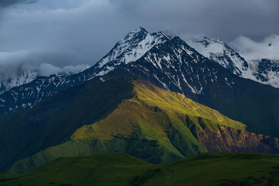 Scenic view of snowcapped mountains against sky