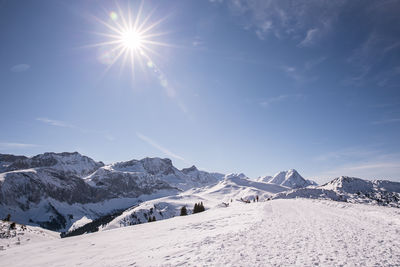 Scenic view of snowcapped mountains against sky