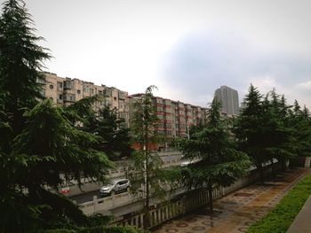 Road in city against clear sky