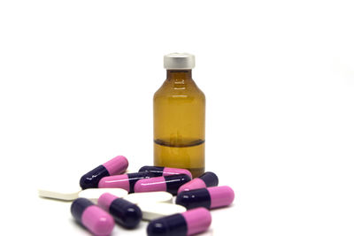 Close-up of glass bottle against white background