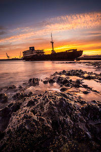 Scenic view of sea against sky during sunset